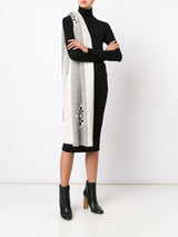 Model wearing Estrella Shawl draped over shoulder, black dress, and ankle boots.