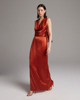 Model wearing a convertible halter dress in a rich auburn color, showcasing its elegant drape and style.