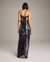 Back view of a model wearing a Midnight Tie Dye Convertible Dress, showcasing the tie detail.