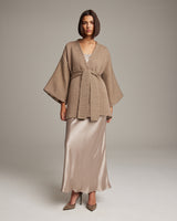 Model wearing a Flammé Samurai Jacket over a satin dress