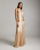 Model wearing a silk palazzo pants and tank top in blush color