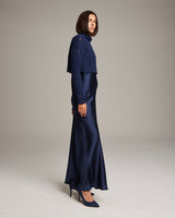 Model wearing a navy Manos Cropped Sweater over a navy slip dress