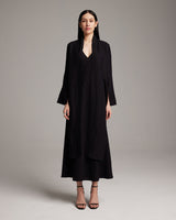 Model wearing a black Linen Featherlight Wrap Blouse with long front sashes