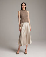 Model wearing a Longer Flammé Knit Crop Top with a beige skirt