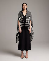 Model wearing a black and white striped Petite Cascade Wrap, standing on a neutral background.