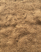 Close-up of textured camel-colored knit of Ribbed Cropped Sweater