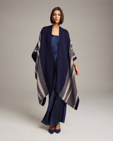 Model wearing a navy and taupe striped Zig Zag Duster over a satin outfit