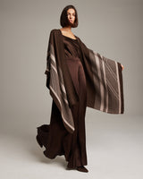 Model wearing a brown Striped Zig Zag Duster with a flowing design