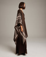 Model wearing a brown Striped Zig Zag Duster shawl, showcasing its design and drape.