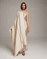 Model wearing a Wide Diagonal Alpaca Wrap in ivory, showcasing its design and texture.