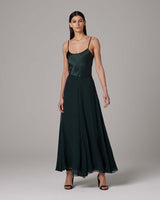 Model wearing a dark green Crinkle Chiffon Double Layer Skirt, flowing and elegant.