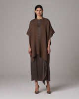 Model wearing a brown solid alpaca duster over a brown dress