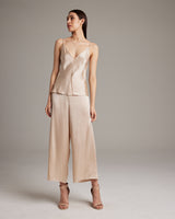 Model wearing a V-Neck Silk Cami and culottes in bone color