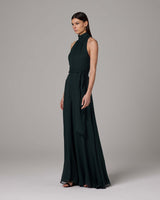 Side view of a model wearing a dark green Crinkle Chiffon Palazzo Jumpsuit