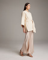 Model wearing a beige Samurai Jacket with a belt, standing on a neutral background.