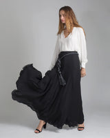Model wearing a black Georgette Long Double Layer Skirt with a flowing silhouette