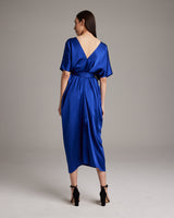 Back view of a sapphire blue kaftan dress with a V-neck and a relaxed fit.