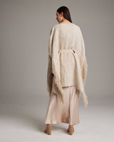 Model wearing a Pearl Fringe Kaftan from the back, showcasing its texture and fringe details.