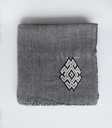 Araña Blanket in Charcoal with geometric design