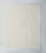 Handwoven Araña Blanket in Ivory featuring sacred symbol design