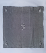 Araña Blanket in Charcoal with intricate patterns and a large size