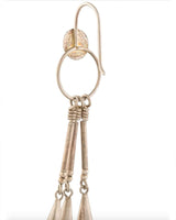 Close-up of silver chandelier earrings with a circular hook and elongated pendants