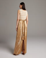 Back view of a model wearing a tie dye convertible dress with a wrap sash