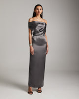 Model wearing a convertible halter dress in silver, showcasing off-shoulder design.