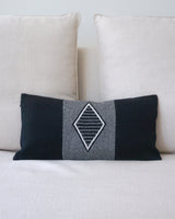 Diamante Lumbar Pillow in Black with diamond pattern on a sofa