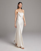 Model wearing a bridal liquid slipdress in ivory, showcasing its elegant design and fit.