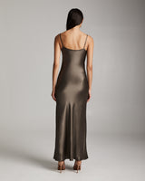 Back view of a model wearing a sage Liquid Silk Slipdress