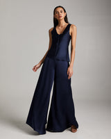 Model wearing a navy silk palazzo pants and matching top