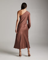 Model wearing a mauve bare shoulder dress, back view