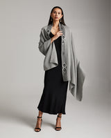 Model wearing the Arrows Edge Wrap in grey, showcasing its design and style.