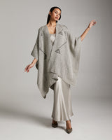 Model wearing a grey Copihue Duster in Baby Alpaca, showcasing its design.