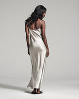 Model wearing a Liquid Silk Slipdress in silver, back view