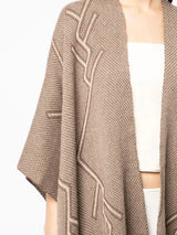 Close-up of a brown Raíz Duster with a Tree of Life design