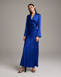 Model wearing a blue Silk Featherlight Wrap Blouse, showcasing its design and fit.