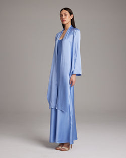 Model wearing a Silk Featherlight Wrap Blouse in periwinkle color