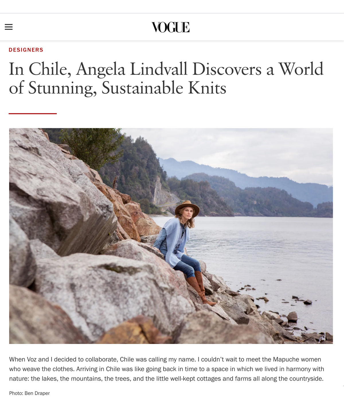 A woman sitting on rocks by a lake in Chile, wearing a hat and looking at the water.