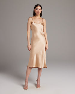 Model wearing a Midi Slip Dress in blush color