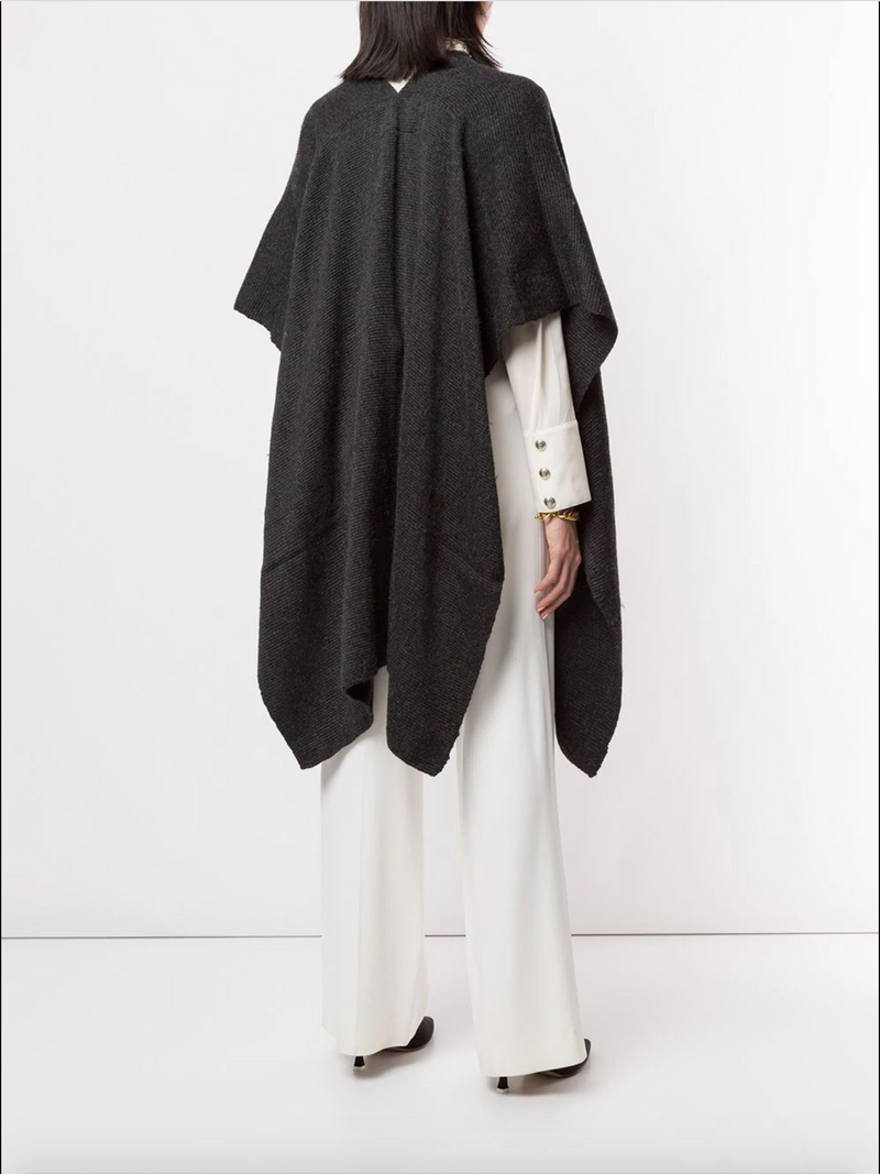Model wearing a Solid Merino Duster from the back, showcasing its design.