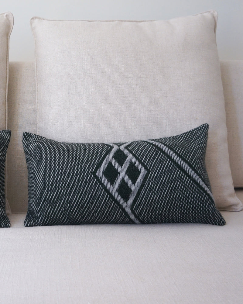 Che Lumbar Pillow in Forest Green with a hand-loomed design and Che symbol