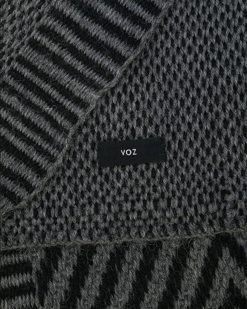 Close-up of Chevron Scarf showing texture and 'voz' label