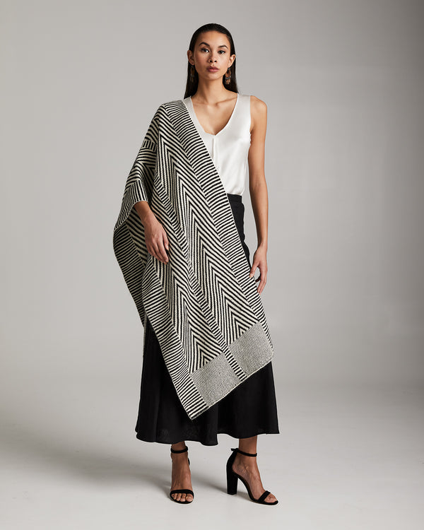 Model wearing a Chevron Shawl in Baby Alpaca, showcasing its design and texture.