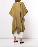 Model wearing a Curvy Fringe Duster in a light brown color, showcasing the back and fringe detail.