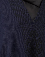 Close-up of navy Manta Estrella with Estrella symbol