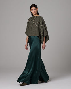 Model wearing Silk Palazzo Pants in green with a patterned top