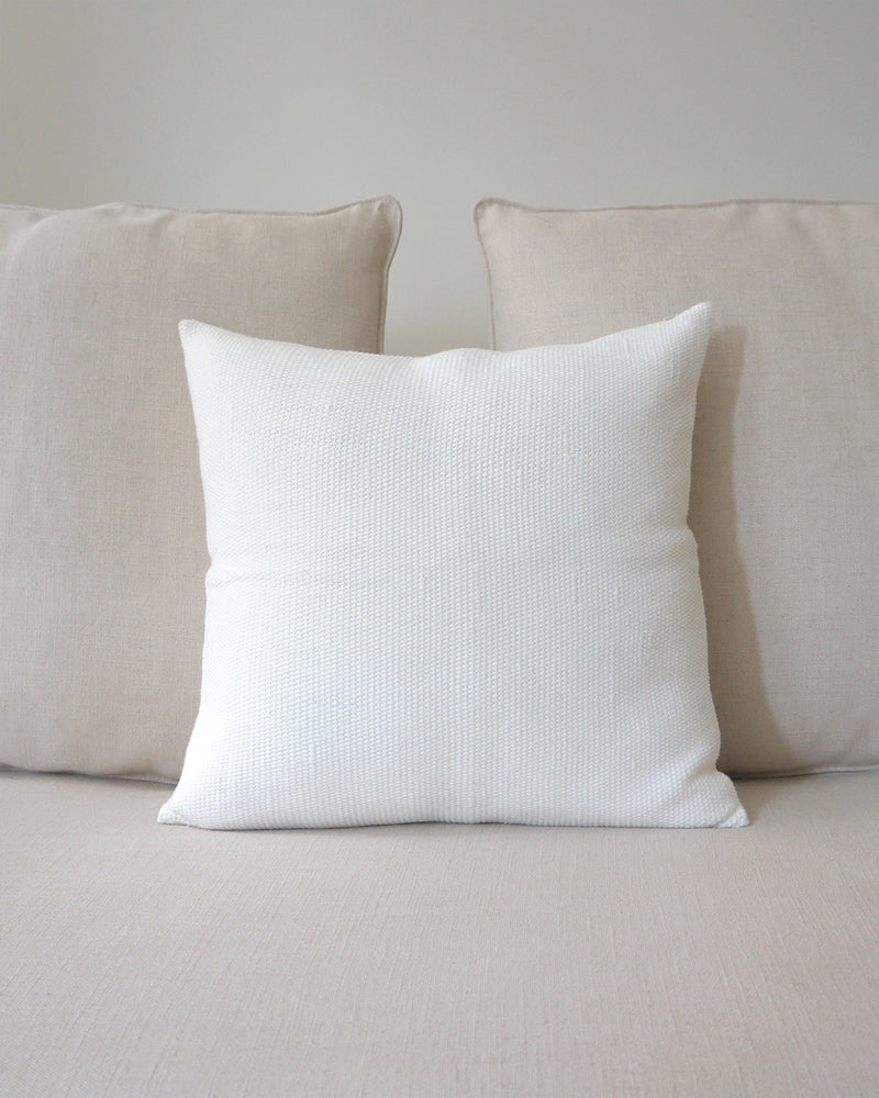 Solid Cotton Euro Pillow in Ivory on a beige couch
