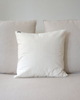 Ivory Solid Cotton Euro Pillow on a sofa